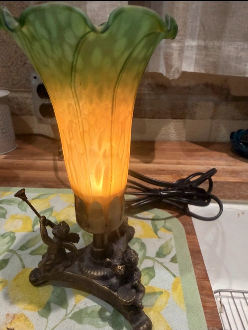 Source Unknown Green and Amber Art Glass Lamp with Cherub Base